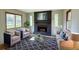 Charming living room with brick fireplace, ample seating, and natural light at 1311 Maple Street Se, Conyers, GA 30013