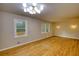 Expansive living room featuring hardwood floors and abundant natural light at 1311 Maple Street Se, Conyers, GA 30013