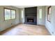 Bright and airy living room featuring a classic fireplace and hardwood floors at 1311 Maple Street Se, Conyers, GA 30013