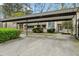 Well-maintained carport with concrete driveway, shaded parking at 2005 Variations Ne Dr, Atlanta, GA 30329