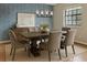 Elegant dining room with a patterned wallpaper, stylish light fixture, and comfortable seating for six at 2005 Variations Ne Dr, Atlanta, GA 30329
