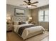 Serene main bedroom with neutral tones, a tufted headboard, and a ceiling fan at 2005 Variations Ne Dr, Atlanta, GA 30329