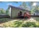Home exterior shows a small deck that leads to a well-maintained backyard at 260 Sterling Dr, Powder Springs, GA 30127