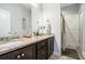 Bathroom featuring double sinks and granite counters plus decorative fixtures at 260 Sterling Dr, Powder Springs, GA 30127