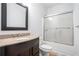 Bathroom features granite countertop, wood cabinets, and shower and tub combination at 260 Sterling Dr, Powder Springs, GA 30127