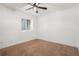 Bedroom with off-white walls, neutral carpet, and a window providing ample natural light at 260 Sterling Dr, Powder Springs, GA 30127
