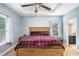 A bright bedroom with a tray ceiling, fan and large windows providing lots of natural light at 260 Sterling Dr, Powder Springs, GA 30127