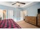 Bedroom featuring a large dresser and multiple doors providing access to other rooms at 260 Sterling Dr, Powder Springs, GA 30127