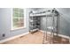 A small bedroom with a high bunk bed and lots of natural light at 260 Sterling Dr, Powder Springs, GA 30127