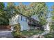 Inviting two-story home with a charming front porch and a well-manicured lawn at 260 Sterling Dr, Powder Springs, GA 30127