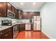 Well-equipped kitchen with stainless steel appliances, dark cabinets, and marble counters at 260 Sterling Dr, Powder Springs, GA 30127