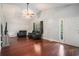 Open living room featuring vaulted ceiling, hardwood floors, and cozy seating at 260 Sterling Dr, Powder Springs, GA 30127