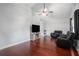 Inviting living room with vaulted ceilings, hardwood floors, and media center at 260 Sterling Dr, Powder Springs, GA 30127