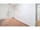 A room with neutral carpet, off-white walls, and an open door leading to another room at 260 Sterling Dr, Powder Springs, GA 30127