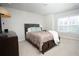Bedroom with a bed, plush carpet, and a bright window with blinds at 3080 W Jackson Way, Austell, GA 30106