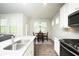 Cozy dining area with lots of natural light, perfect for Gathering meals and entertaining guests at 3080 W Jackson Way, Austell, GA 30106