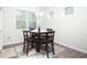 Intimate dining area bathed in natural light, creating a warm and inviting atmosphere at 3080 W Jackson Way, Austell, GA 30106