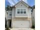 Charming two-story home with brick veneer, garage and light gray siding at 3080 W Jackson Way, Austell, GA 30106