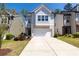 Charming two-story home with brick accents, a well-manicured lawn and a two car garage at 3080 W Jackson Way, Austell, GA 30106