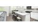 Modern kitchen with granite countertops, stainless steel appliances, and a breakfast bar with seating at 3080 W Jackson Way, Austell, GA 30106