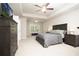 Spacious main bedroom suite with a tray ceiling, plush carpet, and ample closet space at 3080 W Jackson Way, Austell, GA 30106