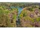 Breathtaking aerial view showcasing the property's waterfront location and lush surrounding landscape at 3125 Lakeside Dr, Cumming, GA 30041
