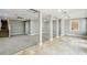 Spacious basement area featuring carpet, tiled flooring and support beams at 3125 Lakeside Dr, Cumming, GA 30041