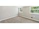 Neutral colored bedroom with carpet, two windows and white trim at 3125 Lakeside Dr, Cumming, GA 30041