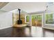 Bright living room with vaulted ceilings, fireplace, and sliding door to a wood deck at 3125 Lakeside Dr, Cumming, GA 30041