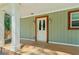 Inviting covered porch with natural wood accents and warm lighting, showcasing the perfect outdoor space at 3125 Lakeside Dr, Cumming, GA 30041