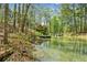 Scenic waterfront property with a dock, offering direct access to the tranquil waters at 3125 Lakeside Dr, Cumming, GA 30041