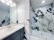 Modern bathroom featuring a glass shower with stylish black and white marble-like tiling at 1206 Park Place Dr, Jonesboro, GA 30236