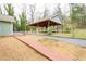 Backyard view of outdoor patio with brick walkway leading to the house at 1206 Park Place Dr, Jonesboro, GA 30236