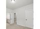 This bedroom features neutral carpet and paint, with doors to other rooms, creating a connected and spacious living area at 3265 Lions Ruby Ln, Atlanta, GA 30349