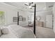 The bedroom with neutral decor is completed with a sitting area and lots of natural light at 3265 Lions Ruby Ln, Atlanta, GA 30349