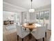 Inviting dining room with a modern light fixture and an open view into a home office at 3265 Lions Ruby Ln, Atlanta, GA 30349