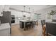 Kitchen featuring white cabinets, a gray island with seating, and stainless steel appliances at 3265 Lions Ruby Ln, Atlanta, GA 30349