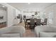 Open-concept kitchen and dining area with stainless steel appliances and white cabinets at 3265 Lions Ruby Ln, Atlanta, GA 30349