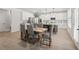 Kitchen and dining area featuring white cabinets, stainless steel appliances, and a center island at 3265 Lions Ruby Ln, Atlanta, GA 30349