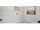 Laundry room with decorative tile floors and a wall-mounted shelf at 3265 Lions Ruby Ln, Atlanta, GA 30349