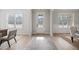 Bright living room with modern decor, a glass door, and large windows providing natural light at 3265 Lions Ruby Ln, Atlanta, GA 30349