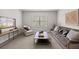 A living room has a neutral color palette and cozy furniture at 3265 Lions Ruby Ln, Atlanta, GA 30349
