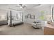 Spacious main bedroom featuring a trey ceiling, sitting area, and ensuite bathroom at 3265 Lions Ruby Ln, Atlanta, GA 30349