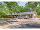 Charming brick home with spacious parking and mature trees, near green lawn at 5150 Scofield Rd, College Park, GA 30349