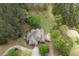 Birds-eye view of the home nestled among mature trees highlighting the lush, wooded lot at 5655 Mccoy Rd Nw, Acworth, GA 30101
