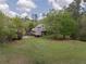 Aerial view of the home highlighting the sprawling manicured lawn and wooded areas at 5655 Mccoy Rd Nw, Acworth, GA 30101