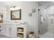 Bright bathroom showcasing double vanity, marble countertops, and a glass-enclosed shower at 5655 Mccoy Rd Nw, Acworth, GA 30101