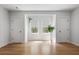 Empty bedroom with hardwood floors, with windows that allow natural light, and neutral paint at 5655 Mccoy Rd Nw, Acworth, GA 30101