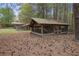 View of the exterior chicken coop and additional equipment sheds on the property at 5655 Mccoy Rd Nw, Acworth, GA 30101