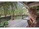 Spacious outdoor deck with dark railings and view of the lush green backyard at 5655 Mccoy Rd Nw, Acworth, GA 30101